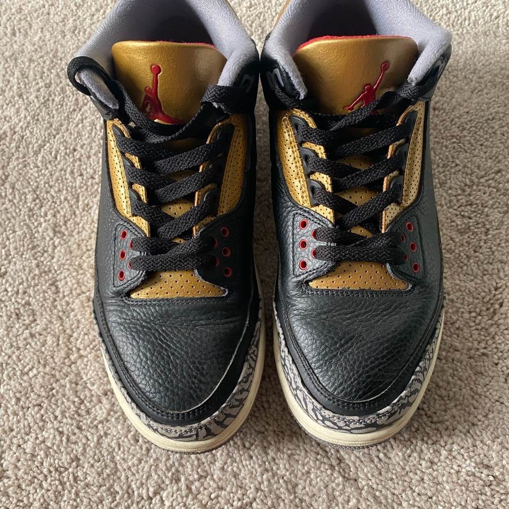 Black and Gold Sneakers with Red Accents
